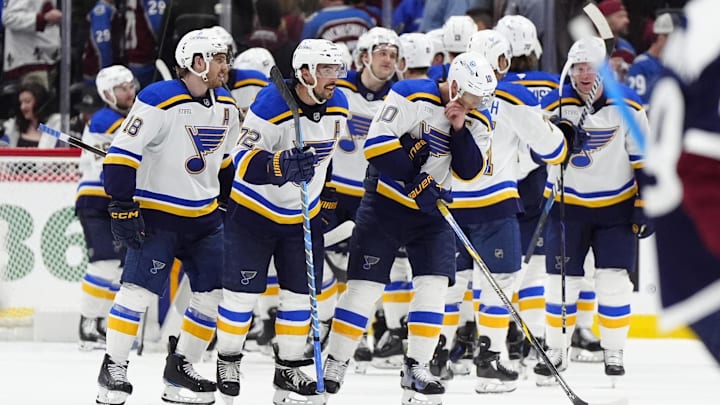 Mar 29, 2025; Denver, Colorado, USA; Members of the St. Louis Blues celebrate defeating the Colorado Avalanche at Ball Arena. Mandatory Credit: Ron Chenoy-Imagn Images