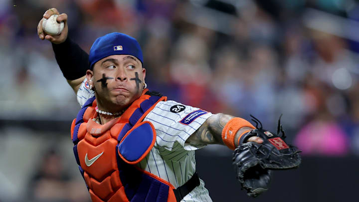 Sep 16, 2024; New York City, New York, USA; New York Mets catcher Francisco Alvarez (4) throws to first on a sacrifice bunt by Washington Nationals second baseman Ildemaro Vargas (not pictured) during the tenth inning at Citi Field. Mandatory Credit: Brad Penner-Imagn Images