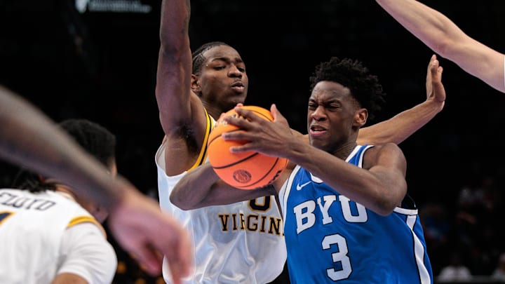 Mar 11, 2026; Kansas City, MO, USA; BYU Cougars forward AJ Dybantsa (3) drives to the basket around West Virginia Mountaineers forward Brenen Lorient (0) during the second half at T-Mobile Center. Mandatory Credit: William Purnell-Imagn Images