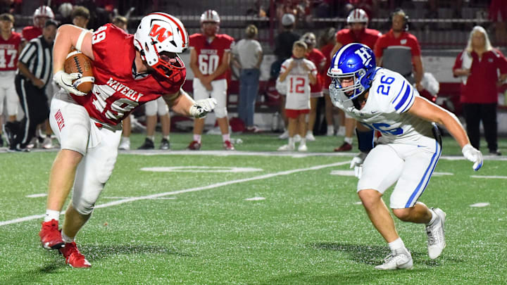 Waverly's Matthias Welles runs with the ball as Horseheads' Lucas Mosher looks to make the tackle during the Wolverines' 34-21 win in football Sept. 20, 2024 at Waverly Memorial Stadium.