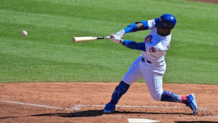 Feb 27, 2023; Mesa, Arizona, USA;  Chicago Cubs right fielder Yonathan Perlaza (87) hits an RBI double in the third inning against the Cleveland Guardians during a spring training game at Sloan Park. Mandatory Credit: Matt Kartozian-Imagn Images