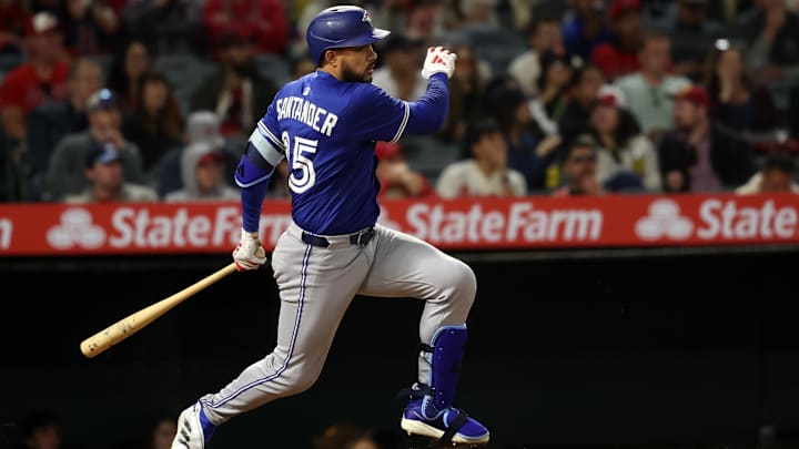 May 7, 2025; Anaheim, California, USA;  Toronto Blue Jays designated hitter Anthony Santander (25) hits an RBI single during the sixth inning against the Los Angeles Angels at Angel Stadium.