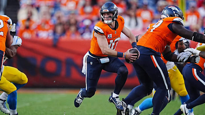 Oct 13, 2024; Denver, Colorado, USA; Denver Broncos quarterback Bo Nix (10) scrambles in the second half against the Los Angeles Chargers at Empower Field at Mile High. Oct 13, 2024; Denver, Colorado, USA; Denver Broncos quarterback Bo Nix (10) scrambles in the second half against the Los Angeles Chargers at Empower Field at Mile High.