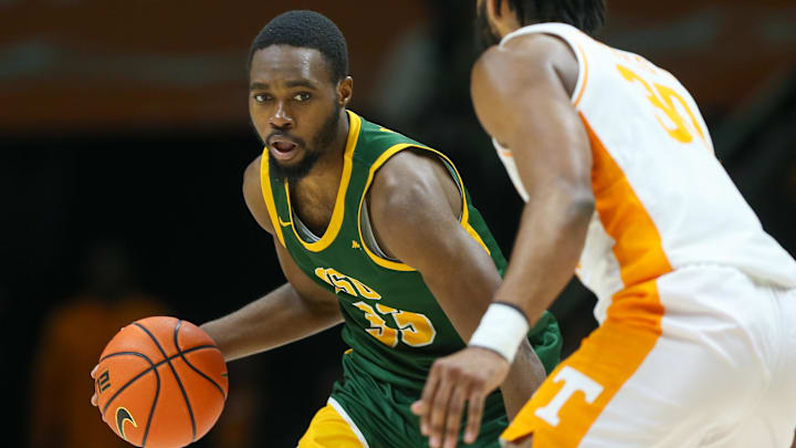 Norfolk State's forward Jack Doumbia (33) brings the ball up court against Tennessee's Josiah-Jordan James.