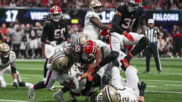 Sep 29, 2024; New Orleans Saints running back Alvin Kamara (41) scores a touchdown past Atlanta Falcons linebacker Kaden Elliss (55) 