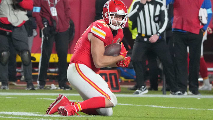 Dec 8, 2024; Kansas City, Missouri, USA; Kansas City Chiefs tight end Travis Kelce (87) catches a pass for a first down against the Los Angeles Chargers during the second half at GEHA Field at Arrowhead Stadium. 
