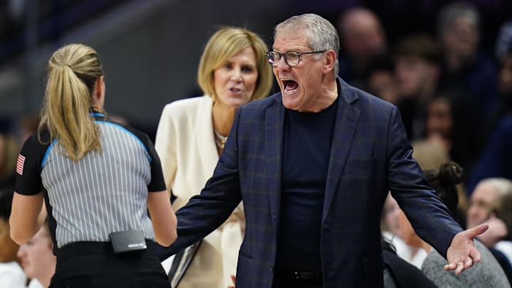 Jan 19, 2026; Storrs, Connecticut, USA; UConn Huskies head coach Geno Auriemma talks with an official from the sideline as they take on the Notre Dame Fighting Irish at Harry A. Gampel Pavilion. Mandatory Credit: David Butler II-Imagn Images