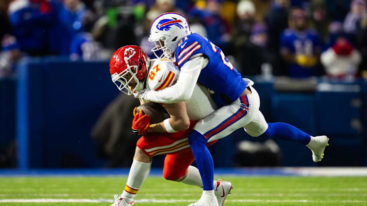 Jan 21, 2024; Orchard Park, New York, USA; Kansas City Chiefs tight end Travis Kelce (87) is tackled by Buffalo Bills safety Jordan Poyer (21) Jan 21, 2024; Orchard Park, New York, USA; Kansas City Chiefs tight end Travis Kelce (87) is tackled by Buffalo Bills safety Jordan Poyer (21)