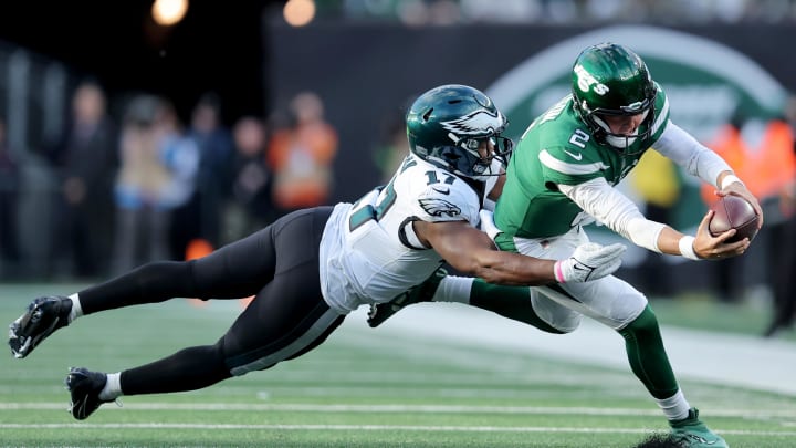 Oct 15, 2023; East Rutherford, New Jersey, USA; New York Jets quarterback Zach Wilson (2) dives for yardage against Philadelphia Eagles linebacker Nakobe Dean (17) during the second quarter at MetLife Stadium. Brad Penner-USA TODAY Sports Oct 15, 2023; East Rutherford, New Jersey, USA; New York Jets quarterback Zach Wilson (2) dives for yardage against Philadelphia Eagles linebacker Nakobe Dean (17) during the second quarter at MetLife Stadium. Brad Penner-USA TODAY Sports