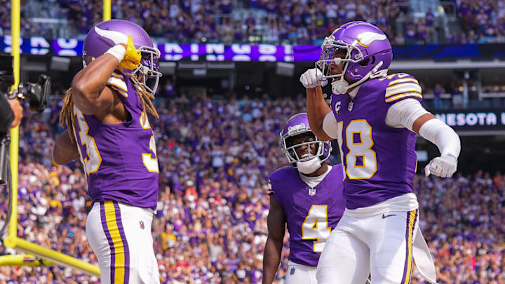 Aaron Jones celebrates his touchdown with Justin Jefferson in the Minnesota Vikings' win over the Houston Texans./ Brad Rempel/Imagn Images