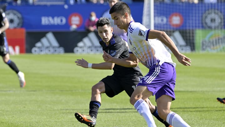 May 7, 2022; Montreal, Quebec, CAN; Orlando City SC defender Joao Moutinho (4) plays the ball and CF