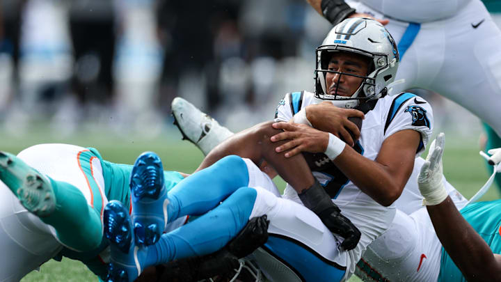 Oct 5, 2025; Charlotte, North Carolina, USA; Carolina Panthers quarterback Bryce Young (9) gets tackled during the third quarter against the Miami Dolphins at Bank of America Stadium. Mandatory Credit: Cory Knowlton-Imagn Images Oct 5, 2025; Charlotte, North Carolina, USA; Carolina Panthers quarterback Bryce Young (9) gets tackled during the third quarter against the Miami Dolphins at Bank of America Stadium. Mandatory Credit: Cory Knowlton-Imagn Images