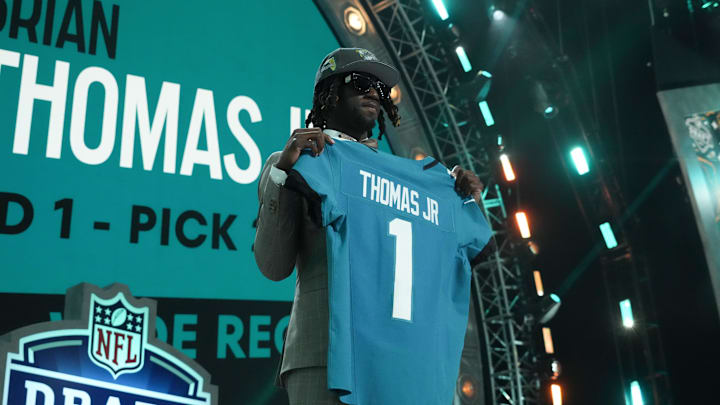 Apr 25, 2024; Detroit, MI, USA; LSU Tigers wide receiver Brian Thomas Jr. poses after being selected by the Jacksonville Jaguars as the No. 23 pick during the first round of the 2024 NFL Draft at Campus Martius Park and Hart Plaza. Mandatory Credit: Kirby Lee-Imagn Images
