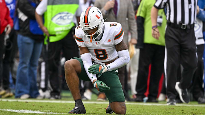 Nov 1, 2025; Dallas, Texas, USA;  Miami Hurricanes defensive back Jakobe Thomas (8) is injured after making a defensive stop against the SMU Mustangs during the second quarter at Gerald J. Ford Stadium. Mandatory Credit: Jerome Miron-Imagn Images