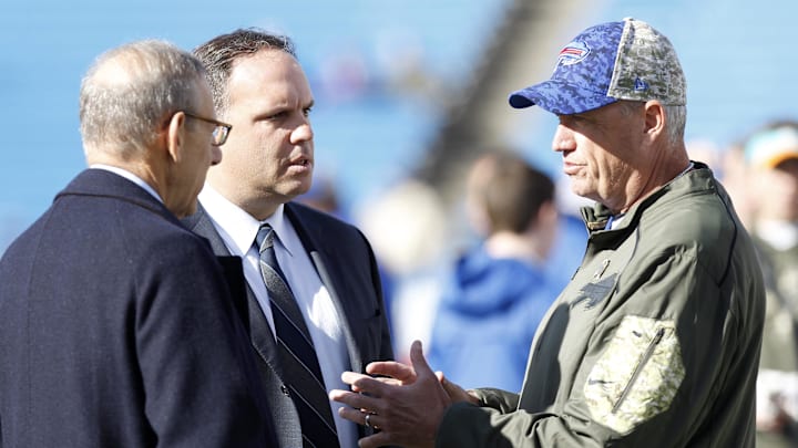 Nov 8, 2015; Orchard Park, NY, USA; Buffalo Bills head coach Rex Ryan (right) talks with Miami Dolphins owner Stephen M. Ross (left) and Mike Tannenbaum the Dolphins executive vice president of football operations before the game at Ralph Wilson Stadium. 