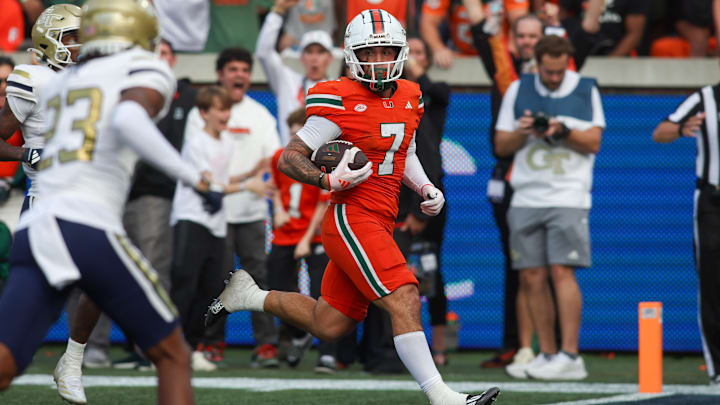 Nov 9, 2024; Atlanta, Georgia, USA; Miami Hurricanes wide receiver Xavier Restrepo (7) catches a pass for a touchdown against the Georgia Tech Yellow Jackets in the fourth quarter at Bobby Dodd Stadium at Hyundai Field. Mandatory Credit: Brett Davis-Imagn Images