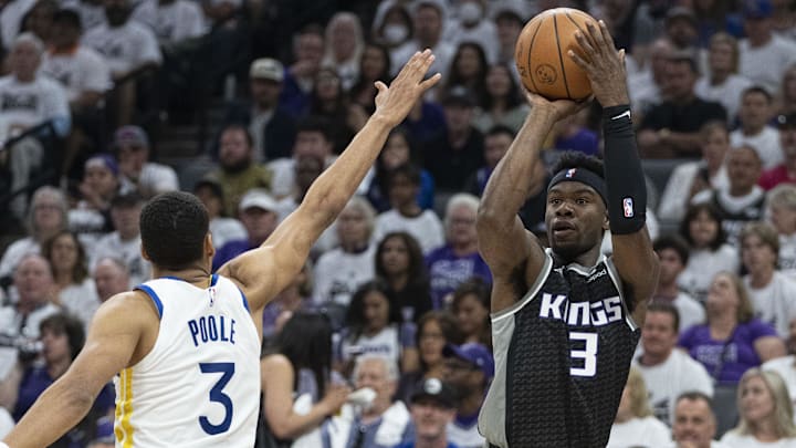 April 30, 2023; Sacramento, California, USA; Sacramento Kings guard Terence Davis (3) shoots the basketball against Golden State Warriors guard Jordan Poole (3) during the first quarter in game seven of the 2023 NBA playoffs first round at Golden 1 Center. 