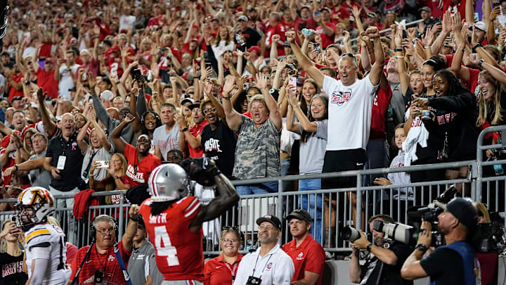 Fans celebrate a touchdown catch by Ohio State Buckeyes wide receiver Jeremiah Smith (4) during the first half of the NCAA football game against the Minnesota Golden Gophers at Ohio Stadium in Columbus on Oct. 4, 2025.
