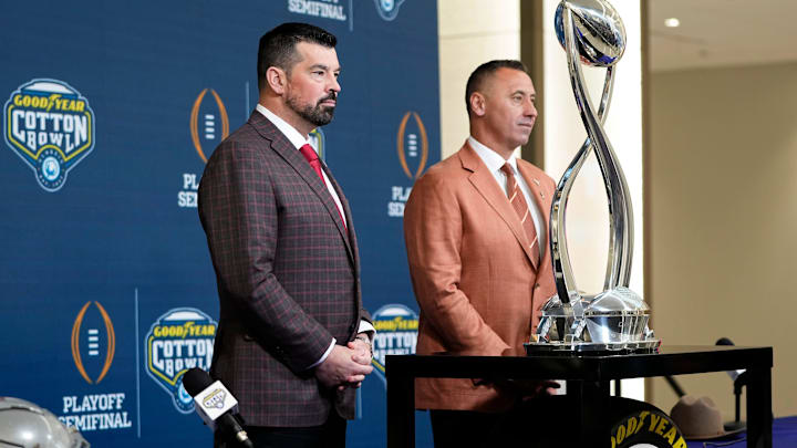 Ohio State Buckeyes head coach Ryan Day and Texas Longhorns head coach Steve Sarkisian stand together following a press conference before the CFP semifinal at the Cotton Bowl Classic.