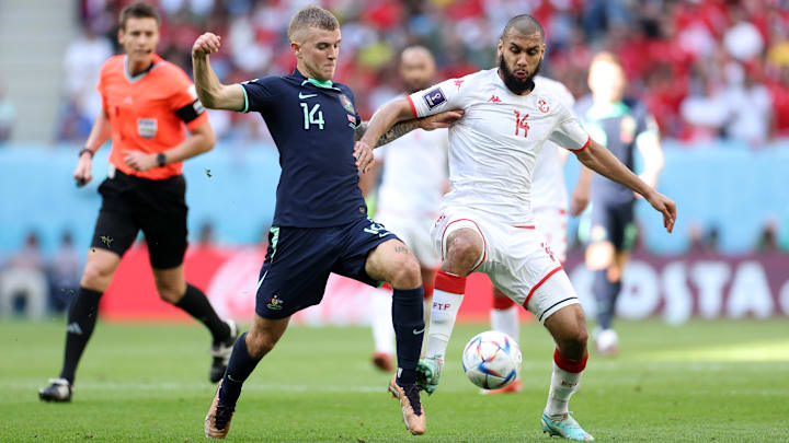 Australia edged out Tunisia in Group B in the second round of group fixtures Australia edged out Tunisia in Group B in the second round of group fixtures