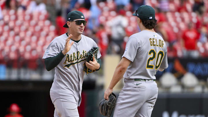 Sep 1, 2025; St. Louis, Missouri, USA;  Athletics right fielder JJ Bleday (33) celebrates with second baseman Zack Gelof (20) after the Athletics defeated the St. Louis Cardinals at Busch Stadium. Mandatory Credit: Jeff Curry-Imagn Images