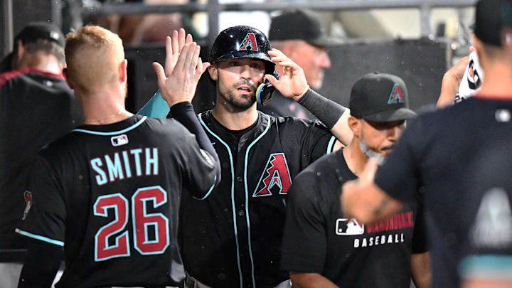 Jun 24, 2025; Chicago, Illinois, USA; Arizona Diamondbacks designated hitter Randal Grichuk (15) celebrates with teammates in the dugout after scoring during the seventh inning against the Chicago White Sox at Rate Field. Mandatory Credit: Patrick Gorski-Imagn Images