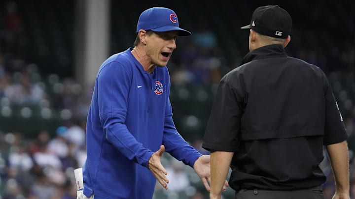 Sep 22, 2024; Chicago, Illinois, USA; Chicago Cubs manager Craig Counsell (30) argues a call with umpire Alfonso Marquez (72) during the eighth inning against the Washington Nationals at Wrigley Field.