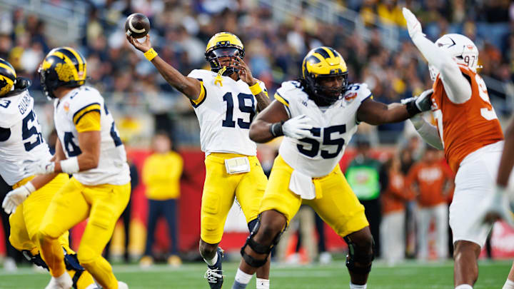 Dec 31, 2025; Orlando, FL, USA; Michigan Wolverines quarterback Bryce Underwood (19) throws the ball against the Texas Longhorns during the second half at Camping World Stadium. Mandatory Credit: Matt Pendleton-Imagn Images
