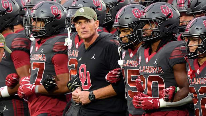 Oklahoma coach Brent Venables locks arms with players before a college football game between the University of Oklahoma Sooners (OU) and the Maine Black Bears at Gaylord Family - Oklahoma Memorial Stadium in Norman, Okla., Saturday, Nov. 2, 2024.