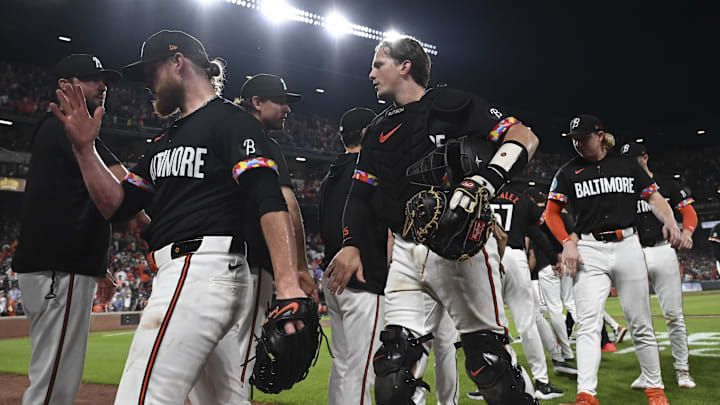 Jun 29, 2024; Baltimore, Maryland, USA;  Baltimore Orioles pitcher Craig Kimbrel (46) and catcher Adley Rutschman (35) celebrates with teammates after the game against the Texas Rangers at Oriole Park at Camden Yards. Mandatory Credit: Tommy Gilligan-Imagn Images