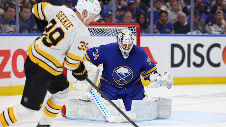 Apr 28, 2026; Buffalo, New York, USA; Boston Bruins center Morgan Geekie (39) looks to take a shot on Buffalo Sabres goaltender Alex Lyon (34) during the third period in game five of the first round of the 2026 Stanley Cup Playoffs at KeyBank Center. Mandatory Credit: Timothy T. Ludwig-Imagn Images