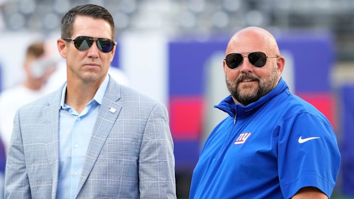 Aug 26, 2023; East Rutherford, New Jersey, USA; New York Giants head coach Brian Daboll (right) and general manager Joe Schoen (left) talk before a game against the New York Jets at MetLife Stadium.  