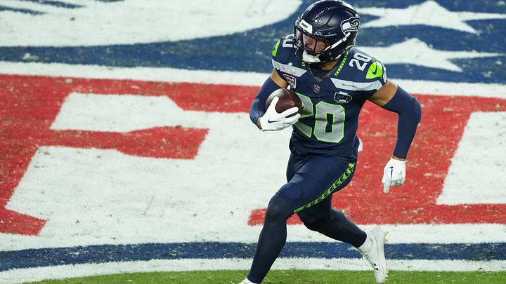 Seattle Seahawks safety Julian Love (20) returns an interception against the New England Patriots in the second half. Seattle Seahawks safety Julian Love (20) returns an interception against the New England Patriots in the second half.