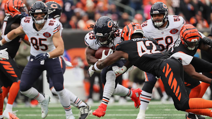 Running back Kyle Monangai runs through the blocking from Darnell Wright and Cole Kmet Sunday in the Bears' win over Cincinnati.