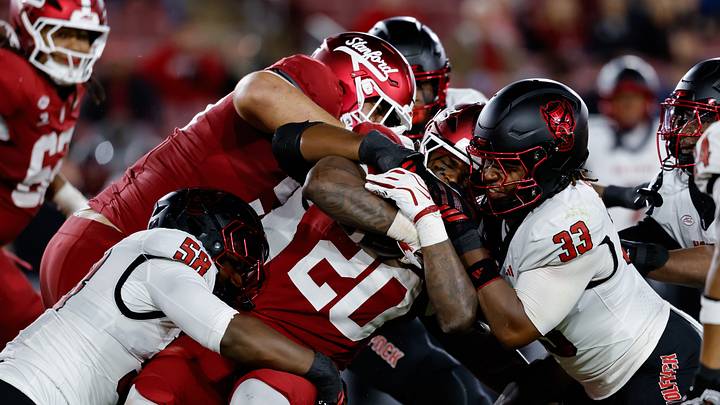 Oct 23, 2026; Stanford, California, USA; Stanford Cardinal running back Micah Ford (20) is stopped by the NC State Wolfpack defense during the second quarter at Stanford Stadium. Mandatory Credit: Sergio Estrada-Imagn Images Oct 23, 2026; Stanford, California, USA; Stanford Cardinal running back Micah Ford (20) is stopped by the NC State Wolfpack defense during the second quarter at Stanford Stadium. Mandatory Credit: Sergio Estrada-Imagn Images