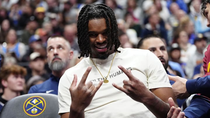 Jan 10, 2025; Denver, Colorado, USA; Denver Nuggets center DaRon Holmes II (14) sits on the bench during the first quarter against the Brooklyn Nets at Ball Arena.