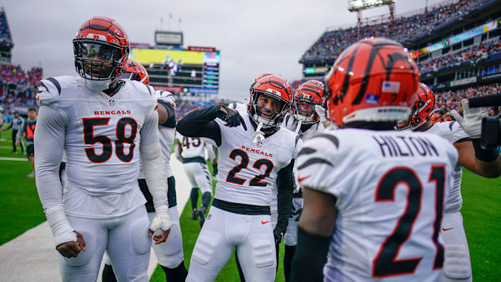 Cincinnati Bengals safety Geno Stone (22) celebrates his touchdown off of an interception of a pass by Tennessee Titans quarterback Will Levis (8) during the third quarter at Nissan Stadium in Nashville, Tenn., Sunday, Dec. 15, 2024.