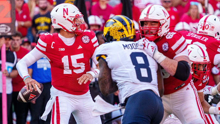Sep 20, 2025; Lincoln, Nebraska, USA; Nebraska Cornhuskers quarterback Dylan Raiola (15) passes against Michigan Wolverines edge Derrick Moore (8) during the third quarter at Memorial Stadium. Mandatory Credit: Dylan Widger-Imagn Images