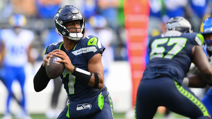Nov 3, 2024; Seattle, Washington, USA; Seattle Seahawks quarterback Geno Smith (7) looks to pass the ball against the Los Angeles Rams during the first half at Lumen Field. Mandatory Credit: Steven Bisig-Imagn Images