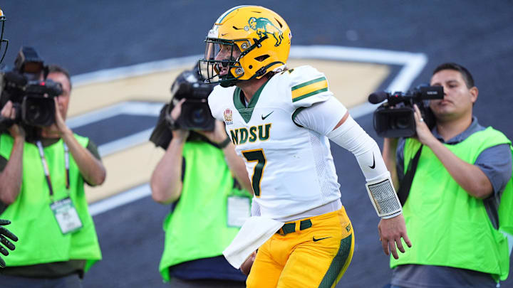 Aug 29, 2024; Boulder, Colorado, USA; North Dakota State Bison quarterback Cam Miller (7) celebrates his rushing touchdown in the second quarter against the Colorado Buffaloes at Folsom Field. Mandatory Credit: Ron Chenoy-Imagn Images Aug 29, 2024; Boulder, Colorado, USA; North Dakota State Bison quarterback Cam Miller (7) celebrates his rushing touchdown in the second quarter against the Colorado Buffaloes at Folsom Field. Mandatory Credit: Ron Chenoy-Imagn Images