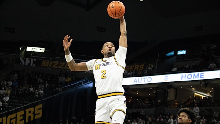 Dec. 3, 2024; Columbia, Mo. USA; Missouri Tigers guard Tamar Bates (2) leaps up for a dunk during a game against the California Golden Bears at Mizzou Arena.