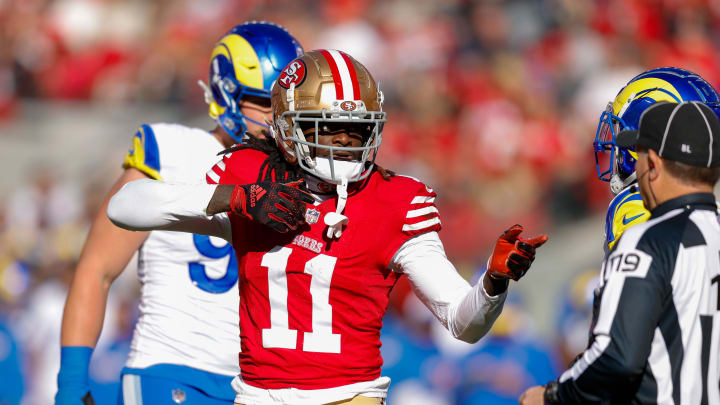 Jan 7, 2024; Santa Clara, California, USA; San Francisco 49ers wide receiver Brandon Aiyuk (11) celebrates after a play against the Los Angeles Rams during the first quarter at Levi's Stadium. Mandatory Credit: Sergio Estrada-USA TODAY Sports