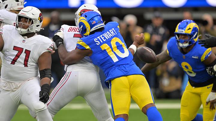 Jan 4, 2026; Inglewood, California, USA; Arizona Cardinals quarterback Jacoby Brissett (7) is strip sacked by Los Angeles Rams linebacker Josaiah Stewart (10) during the first half at SoFi Stadium. Mandatory Credit: Jayne Kamin-Oncea-Imagn Images Jan 4, 2026; Inglewood, California, USA; Arizona Cardinals quarterback Jacoby Brissett (7) is strip sacked by Los Angeles Rams linebacker Josaiah Stewart (10) during the first half at SoFi Stadium. Mandatory Credit: Jayne Kamin-Oncea-Imagn Images
