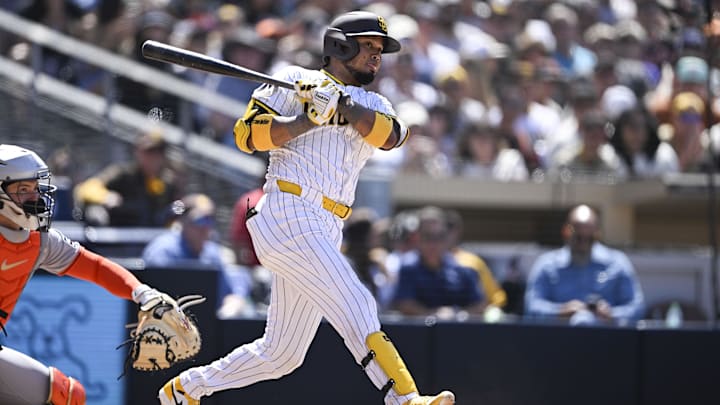 Apr 30, 2025; San Diego, California, USA; San Diego Padres first baseman Luis Arraez (4) hits an RBI triple during the sixth inning against the San Francisco Giants at Petco Park. Mandatory Credit: Denis Poroy-Imagn Images Apr 30, 2025; San Diego, California, USA; San Diego Padres first baseman Luis Arraez (4) hits an RBI triple during the sixth inning against the San Francisco Giants at Petco Park. Mandatory Credit: Denis Poroy-Imagn Images