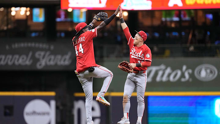 Sep 26, 2025; Milwaukee, Wisconsin, USA;  Cincinnati Reds shortstop Elly De La Cruz (44) greets center fielder TJ Friedl (29) following the game against the Milwaukee Brewers at American Family Field. Mandatory Credit: Jeff Hanisch-Imagn Images