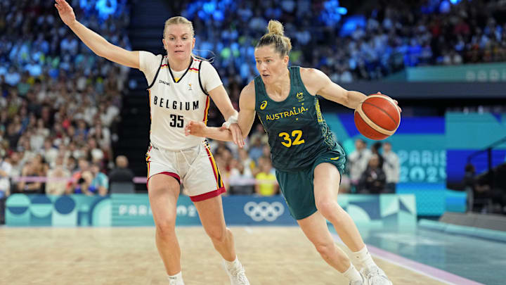 Aug 11, 2024; Paris, France; Australia guard Sami Whitcomb (32) drives to the basket against Belgium point guard Julie Vanloo (35) in the women's basketball bronze medal game during the Paris 2024 Olympic Summer Games at Accor Arena. Mandatory Credit: Kyle Terada-Imagn Images