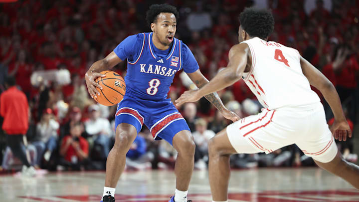 Mar 3, 2025; Houston, Texas, USA; Houston Cougars guard L.J. Cryer (4) defends against Kansas Jayhawks guard David Coit (8) during the first half at Fertitta Center. Mandatory Credit: Troy Taormina-Imagn Images Mar 3, 2025; Houston, Texas, USA; Houston Cougars guard L.J. Cryer (4) defends against Kansas Jayhawks guard David Coit (8) during the first half at Fertitta Center. Mandatory Credit: Troy Taormina-Imagn Images