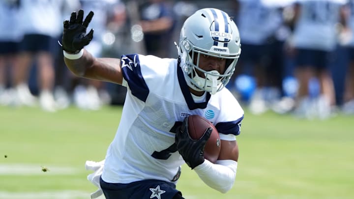 Dallas Cowboys receiver Traeshon Holden carries the ball during training camp at the River Ridge Fields.