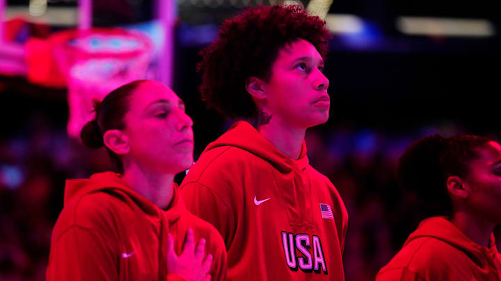 Team USA Diana Taurasi (L) and Brittney Griner listen to the national anthem during the WNBA All-Star Game at Footprint Center in Phoenix on July 20, 2024.