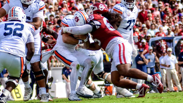 Oklahoma defensive tackle Jayden Jackson sacks Auburn quarterback Jackson Arnold.